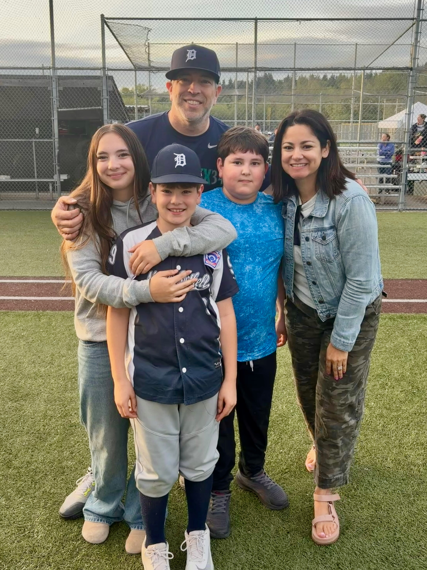 The whole family at the AAA Championship Game for our local Little League, May 2026